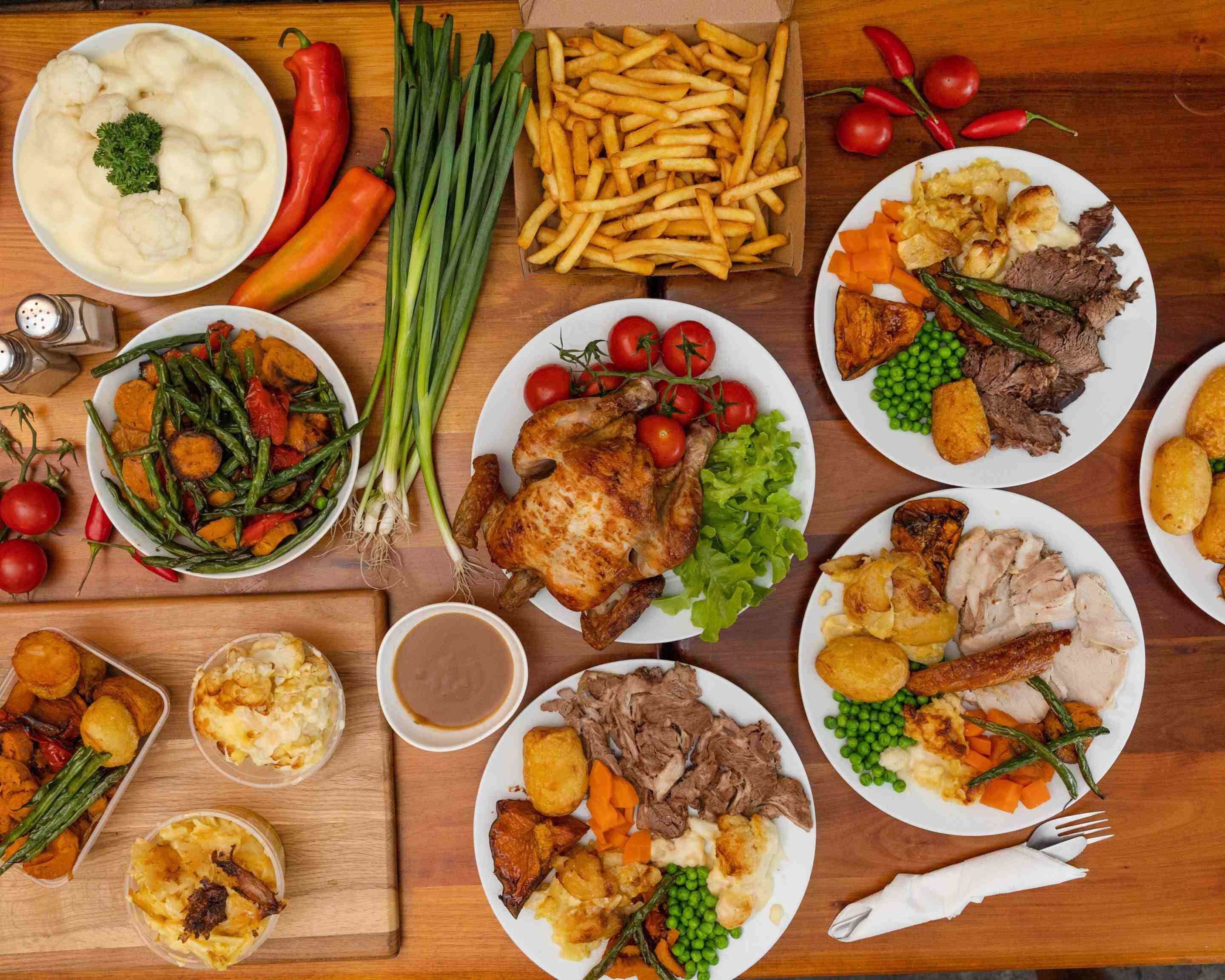 The Carvery Food Spread Across Table